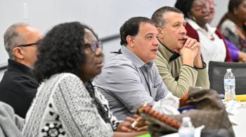 People participate in a discussion at a Racial Equity Conference People participate in a discussion at a Racial Equity Conference